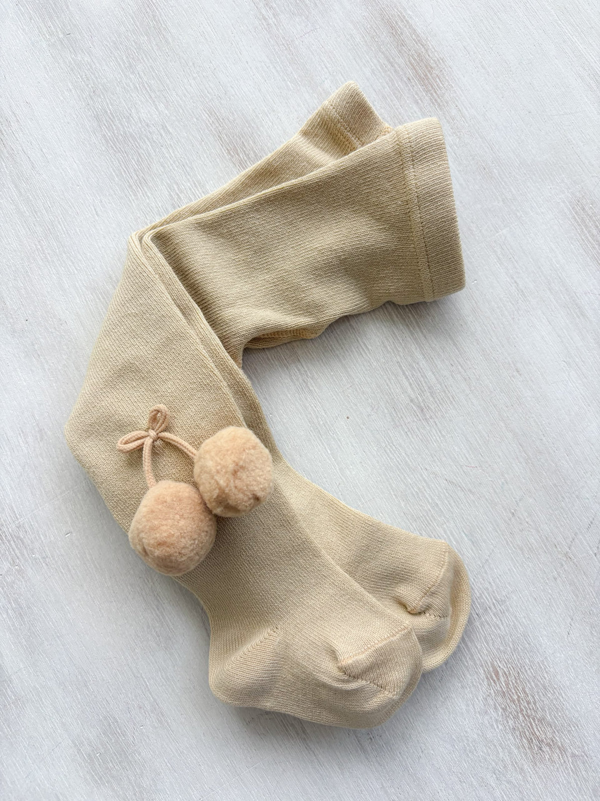 Leotardos c/pompón beige