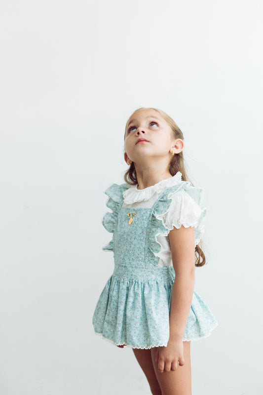 Jumper flores mini morado fondo verde agua