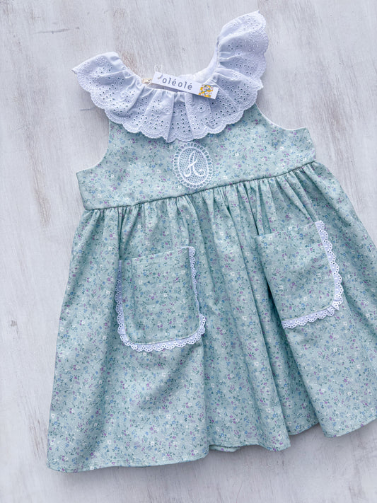 Vestido bolsillo flores mini morado fondo verde agua