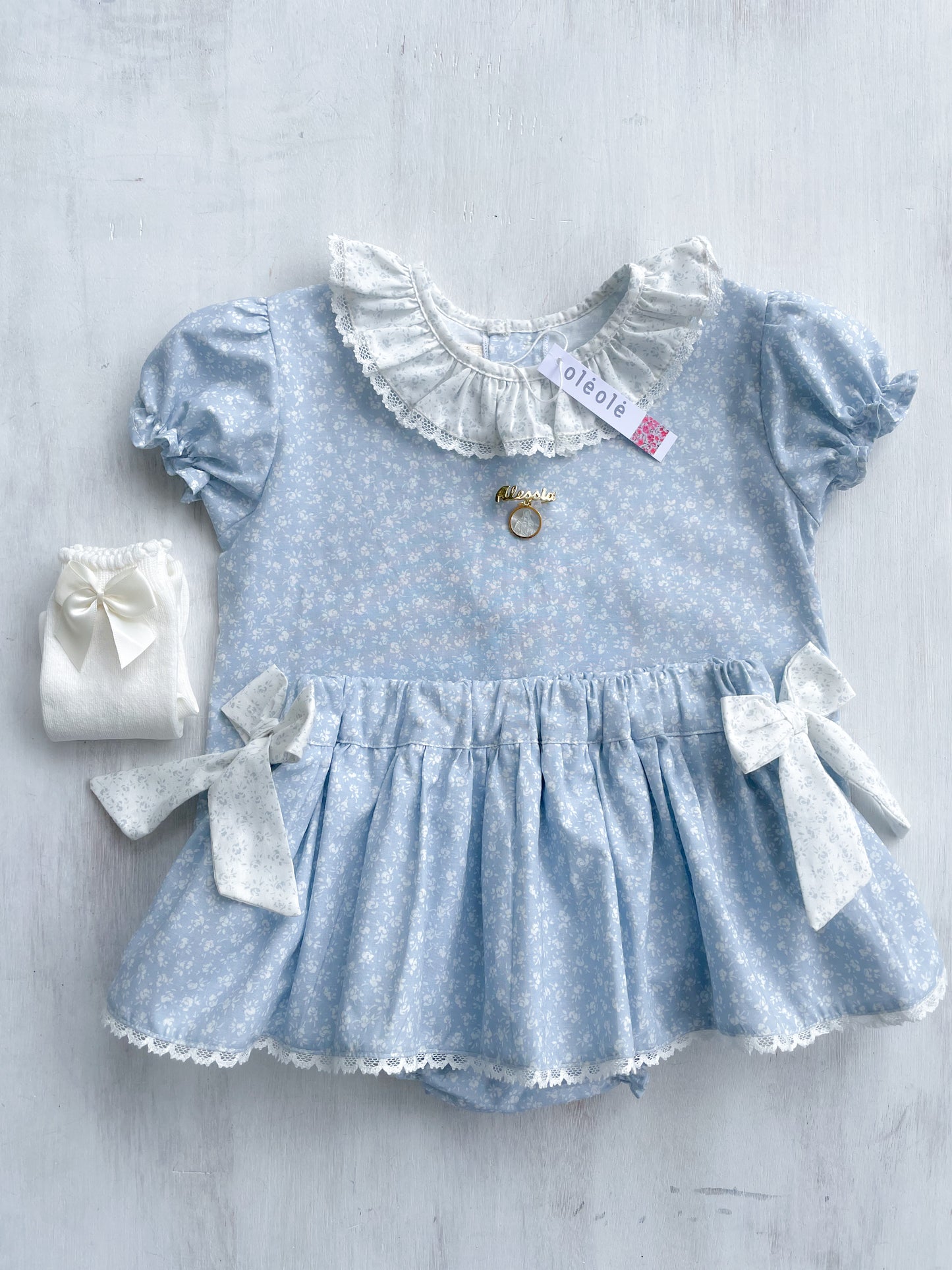 Conjunto Matchymatchy falda c/lazos flores mini fondo azul