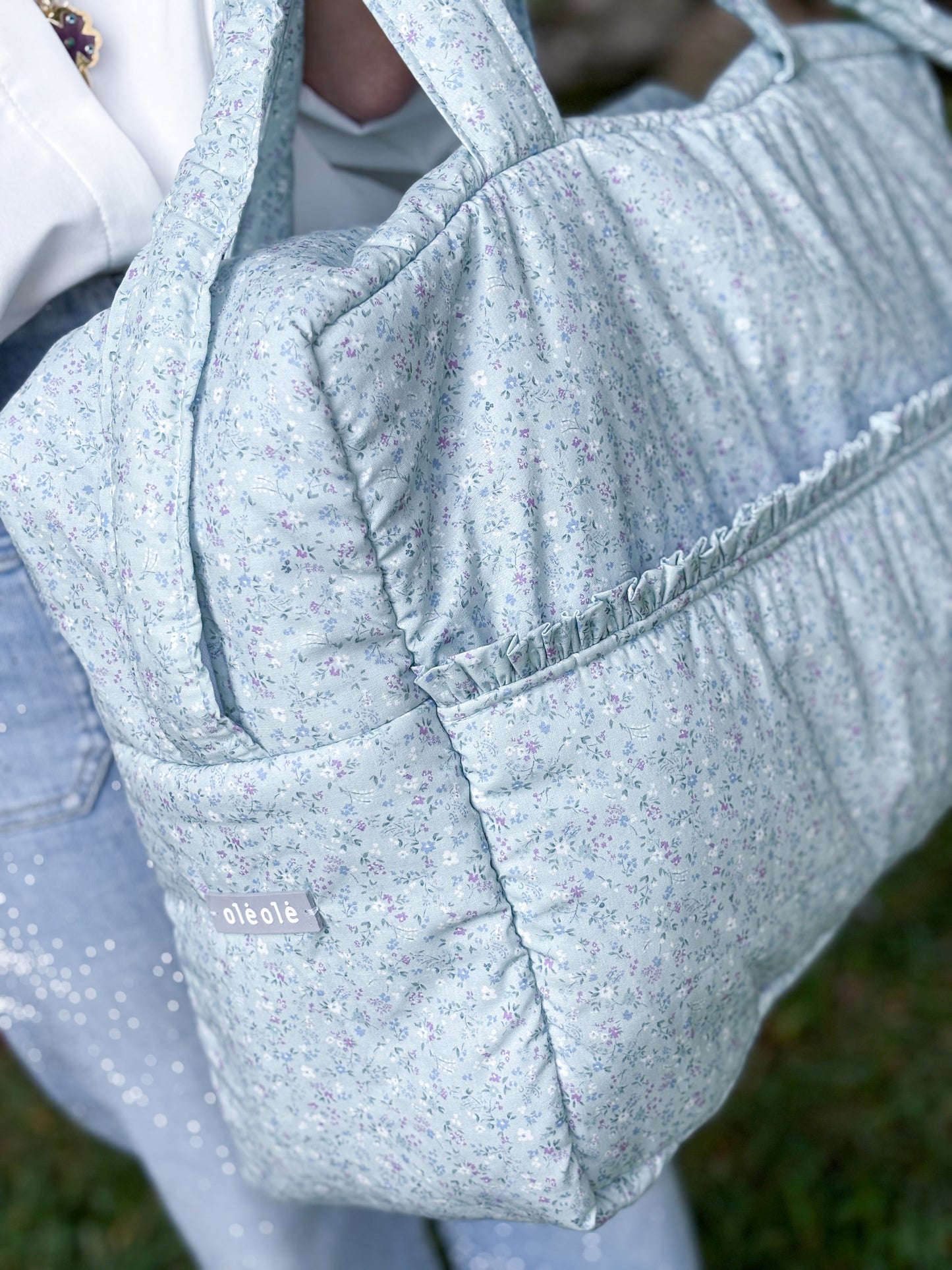 OlėOlėBag flores mini morado fondo verde agua