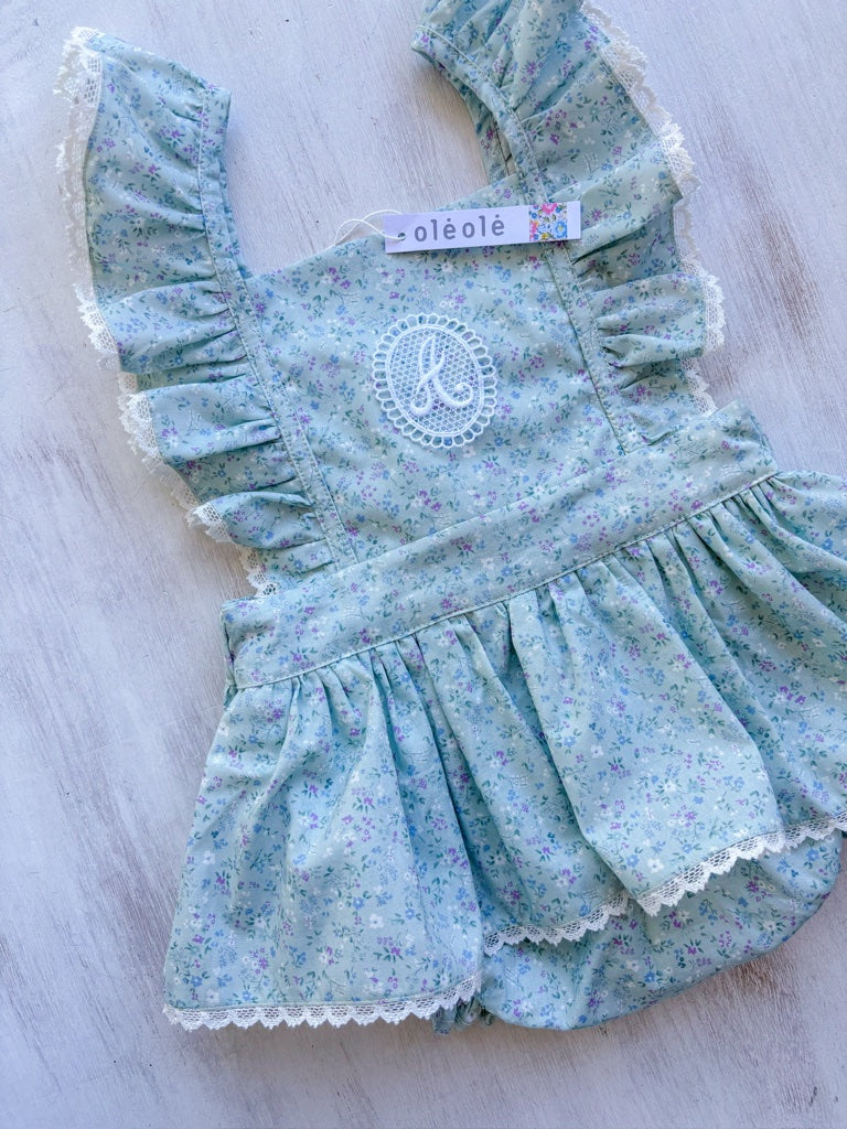 Jumper flores mini morado fondo verde agua