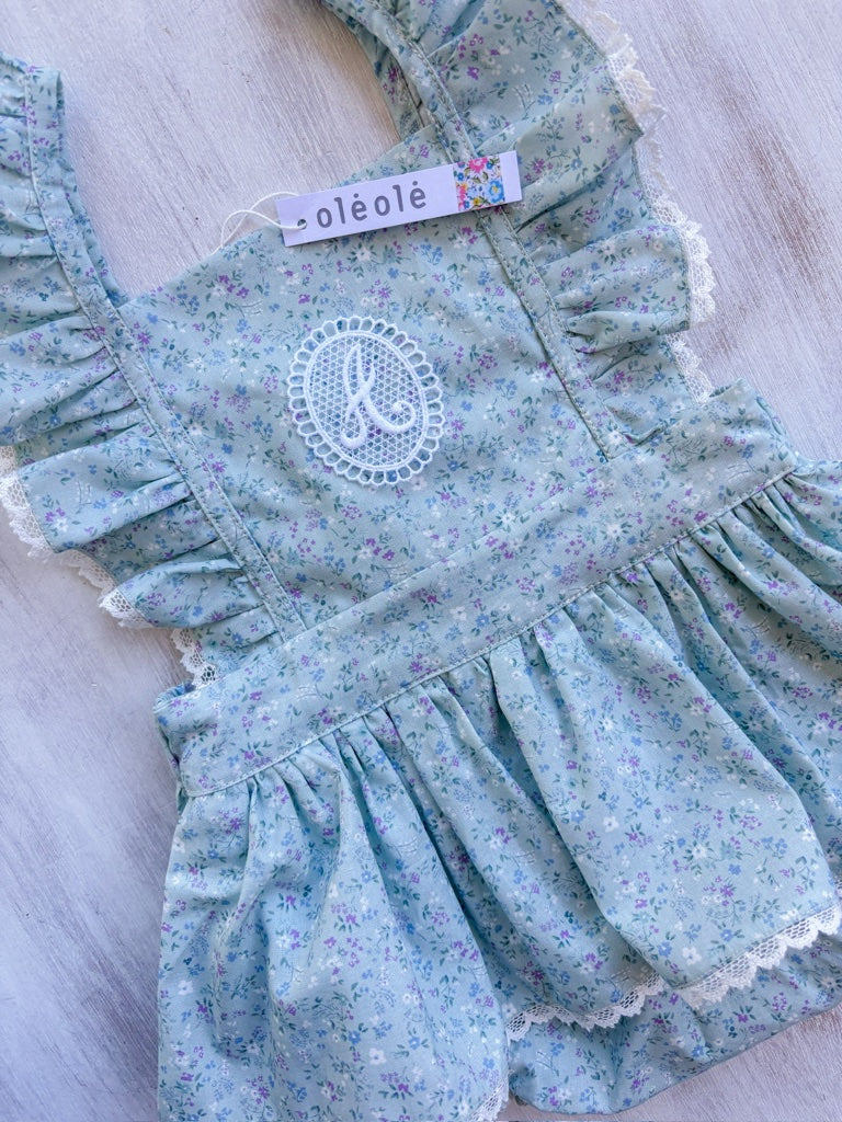 Jumper flores mini morado fondo verde agua