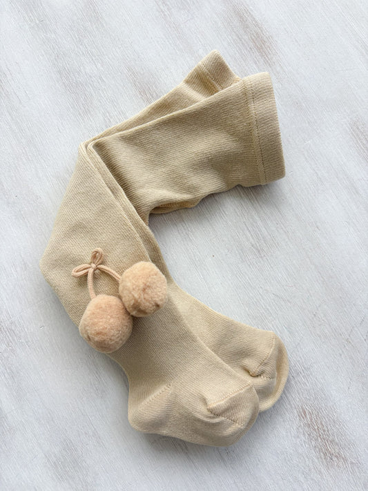 Leotardos c/pompón beige
