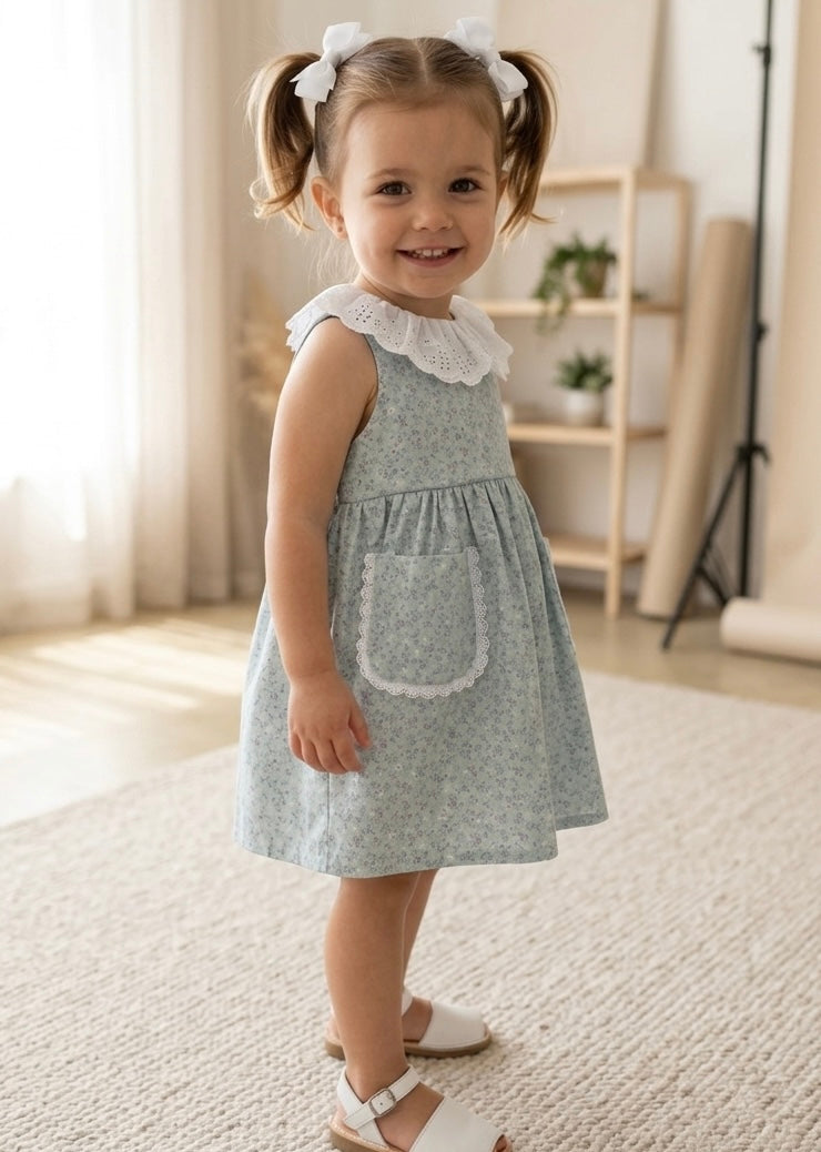 Vestido bolsillo flores mini morado fondo verde agua