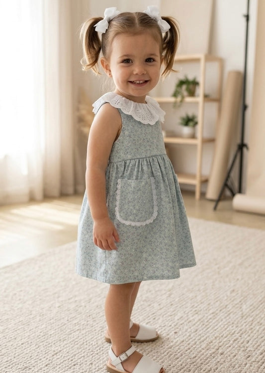 Vestido bolsillo flores mini morado fondo verde agua
